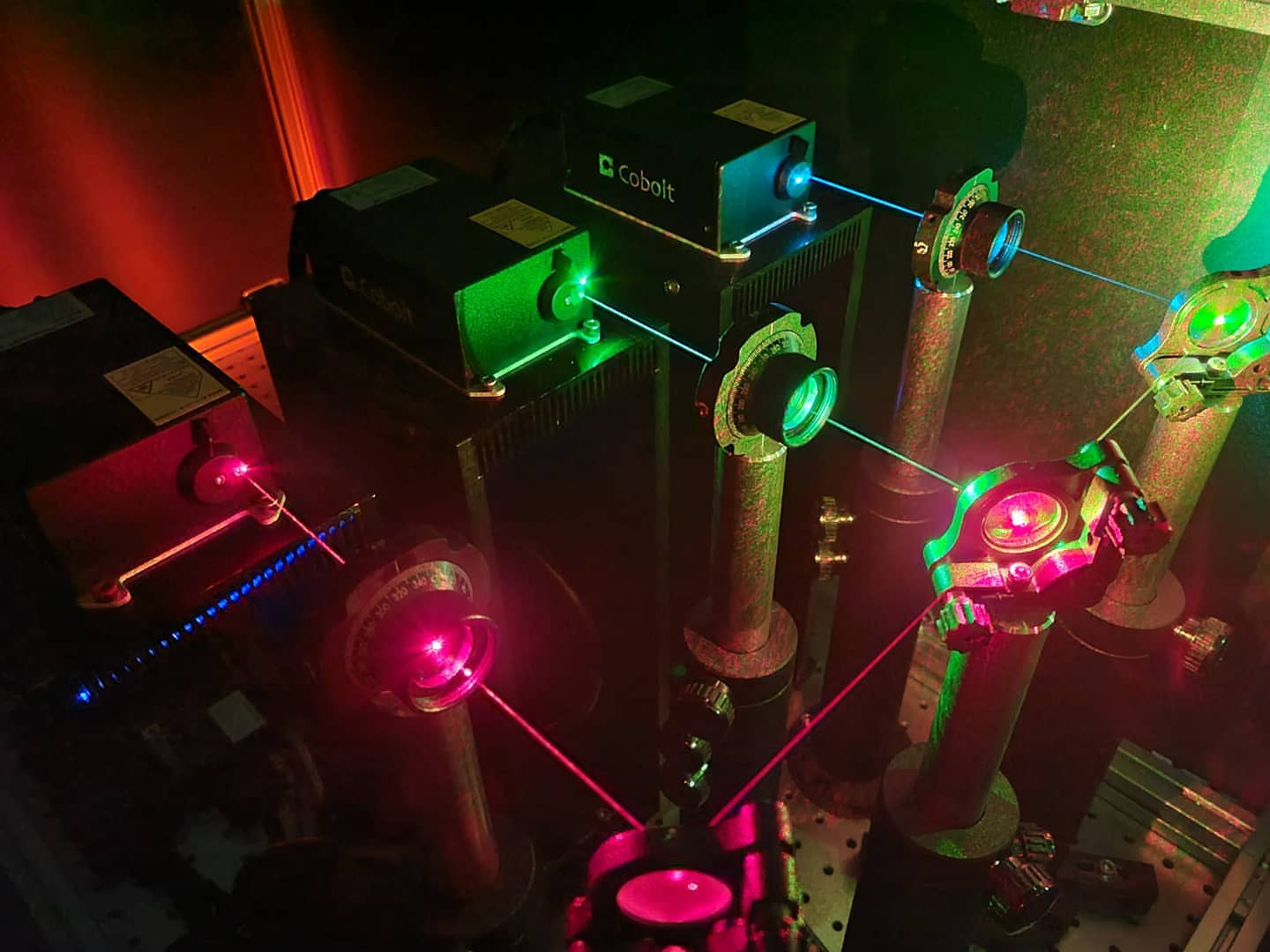RGB laser setup with red, green and blue beams through lenses and mounts